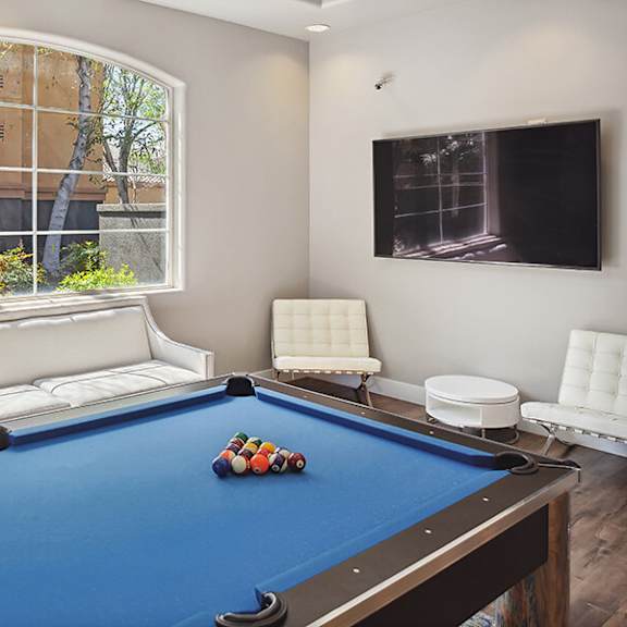 community clubhouse pool table at reserve at rancho belago apartments in moreno valley, ca.