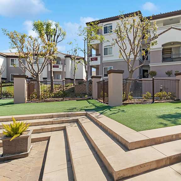 exterior community building and landscape at reserve at rancho apartments located in moreno valley, ca.