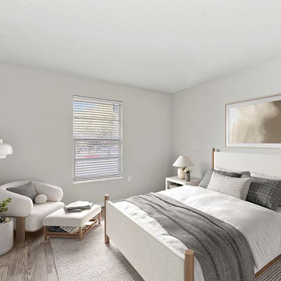 model bedroom with carpet and window view at seven lakes at carrollwood apartments in tampa, fl.