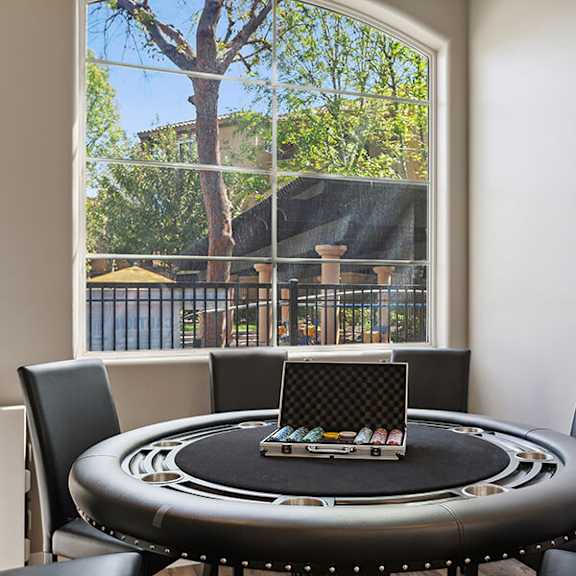 community clubhouse poker table at reserve at rancho belago apartments in moreno valley, ca.
