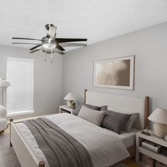 model bedroom with a bed and a ceiling fan