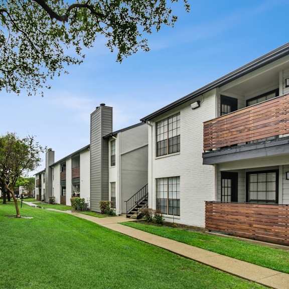 apartment building exterior showcasing private patios