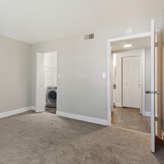 model bedroom with carpet at seven lakes at carrollwood in tampa, florida.