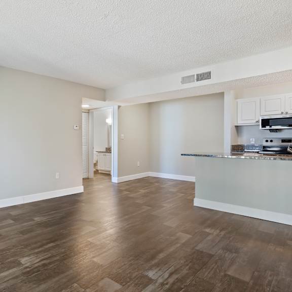 model living room with wood flooring at seven lakes at carrollwood in tampa, florida.