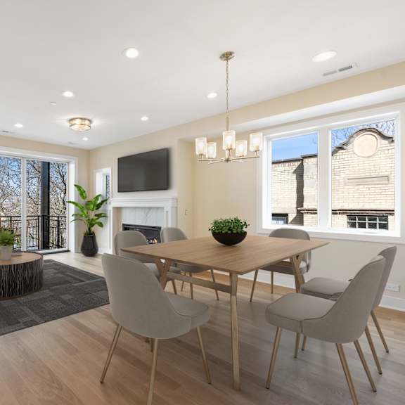 a modern dining room with a wooden table and chairs.