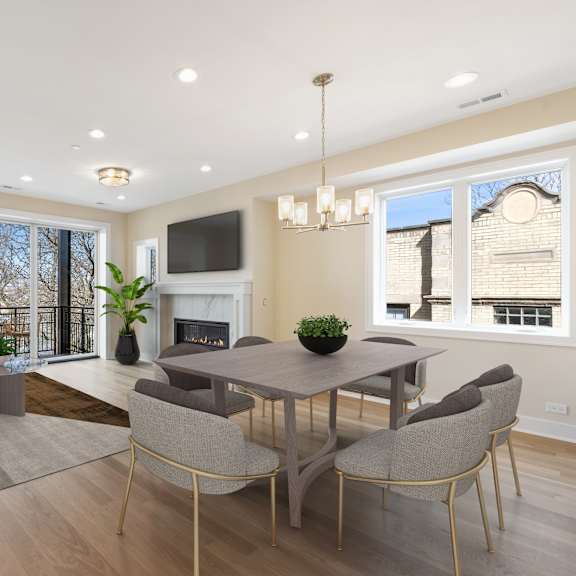 a modern living room with a fireplace and a dining table set up.