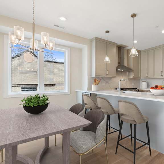 a modern kitchen with a dining table and chairs.