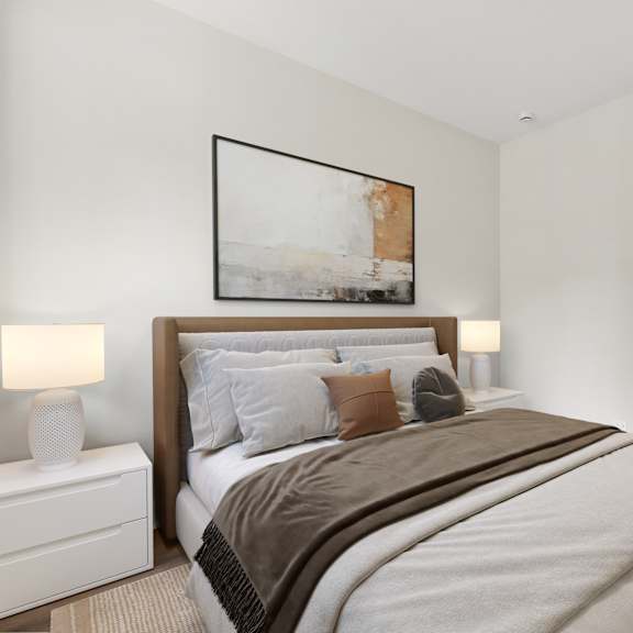 a bedroom with a large bed and a painting on the wall.