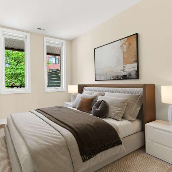a bedroom with a large bed and a potted plant.