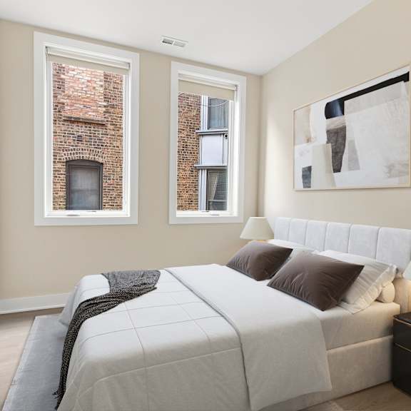 a bedroom with a large bed and a painting on the wall.