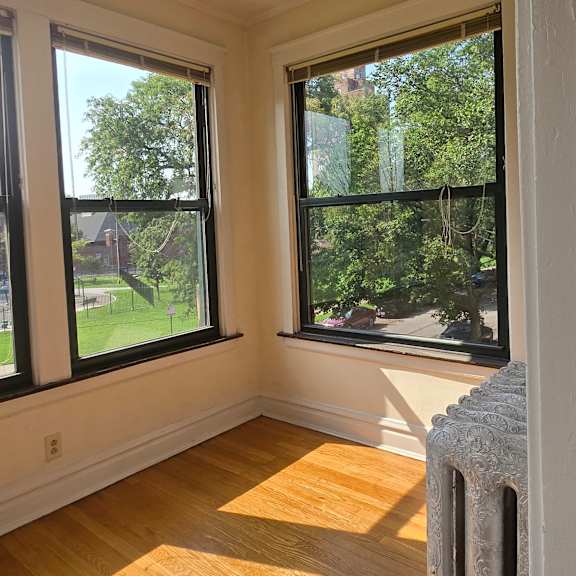 a view from the top of a stairwell looking down at a window.