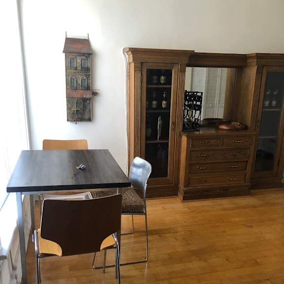 a kitchen with wooden cabinets and a black stove top oven.