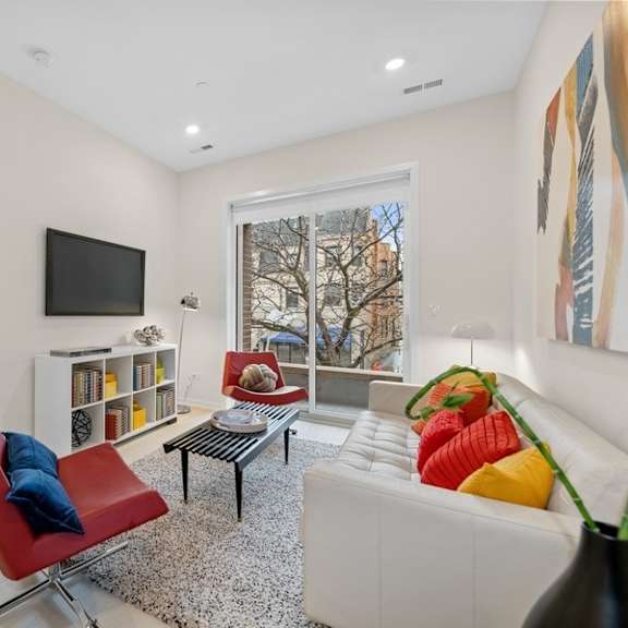 a living room with a couch and a tv