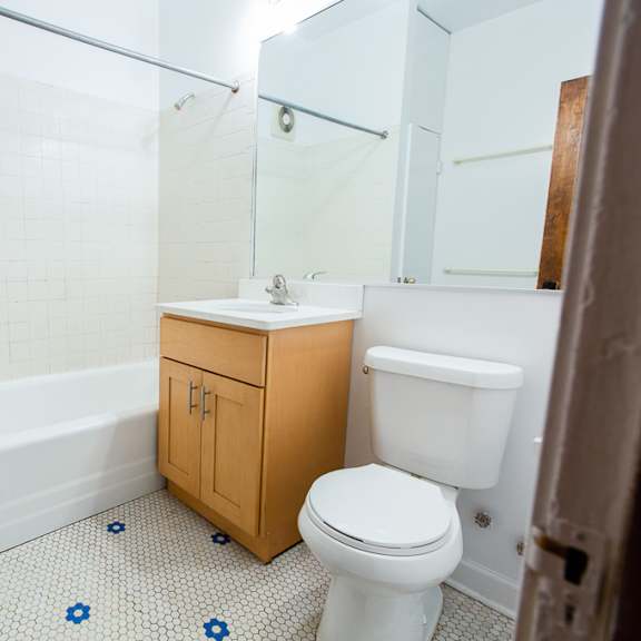 an empty bathroom with a toilet and a sink