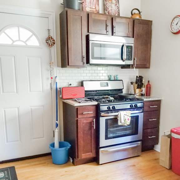 a kitchen with a stove and a microwave