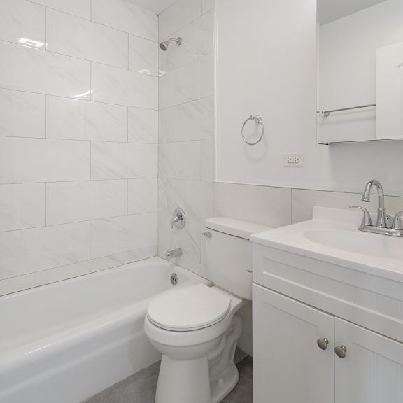 a bathroom with a toilet sink and bathtub