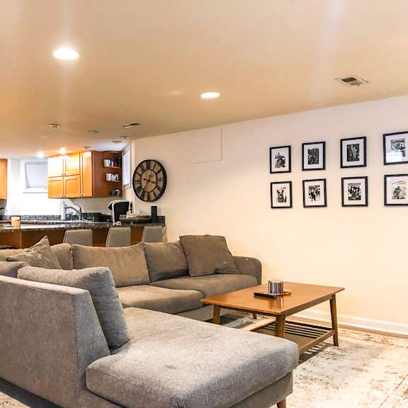 a living room with a grey couch and a coffee table.