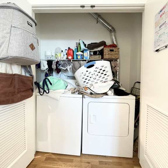 a small laundry room with a washer and dryer.