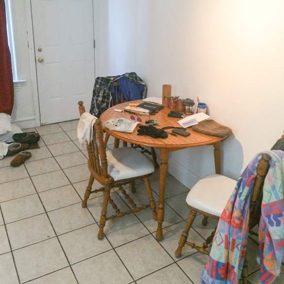 a table with chairs and a blanket on it.