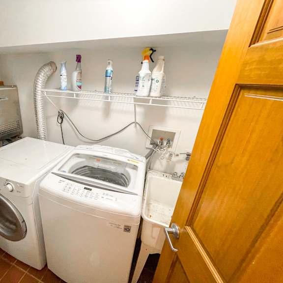 a laundry room with a washer and dryer.