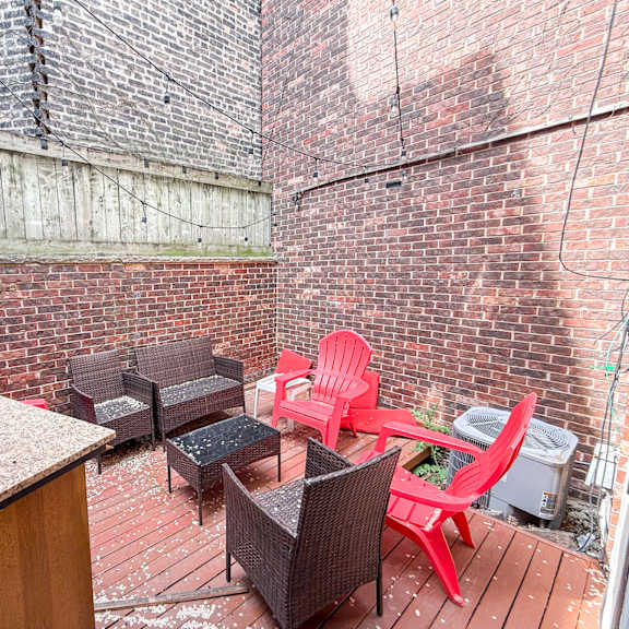 a patio with a table and chairs.