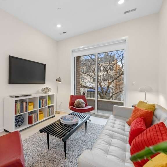 a living room with a couch and a television