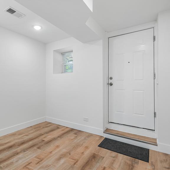 a white door is on the right side of the image.