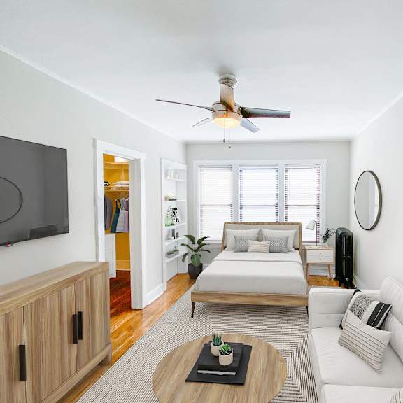 a living room with a white couch and a wooden coffee table.