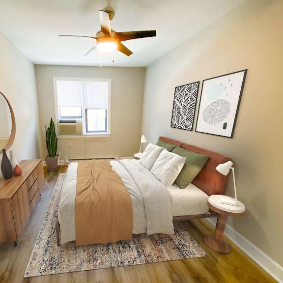 a bedroom with a bed and a ceiling fan