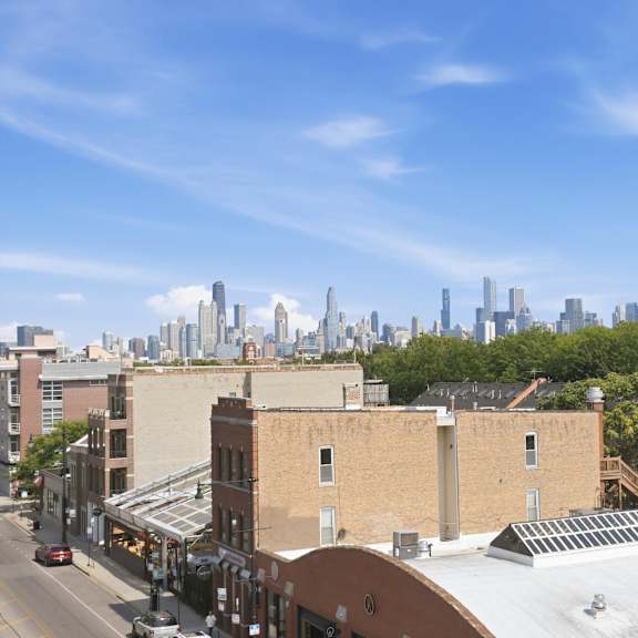 a cityscape with buildings and a clear sky.