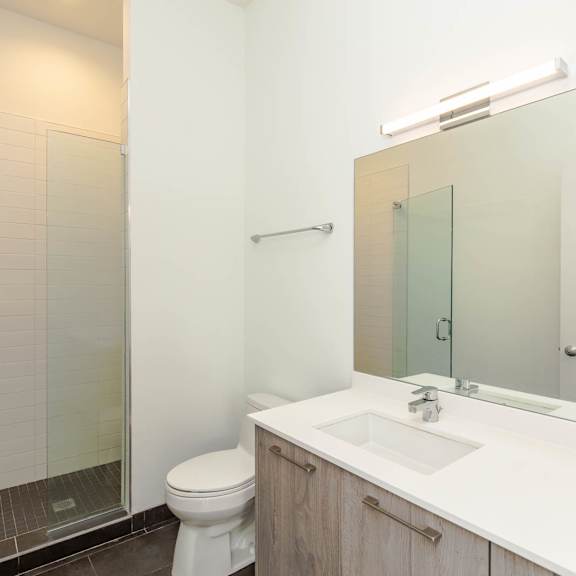 a bathroom with a sink toilet and a shower