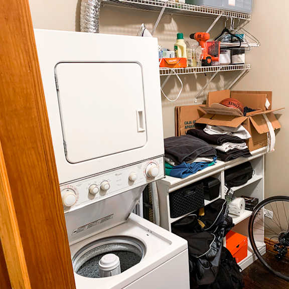 a bicycle is leaning against a wall in a small, cluttered room.