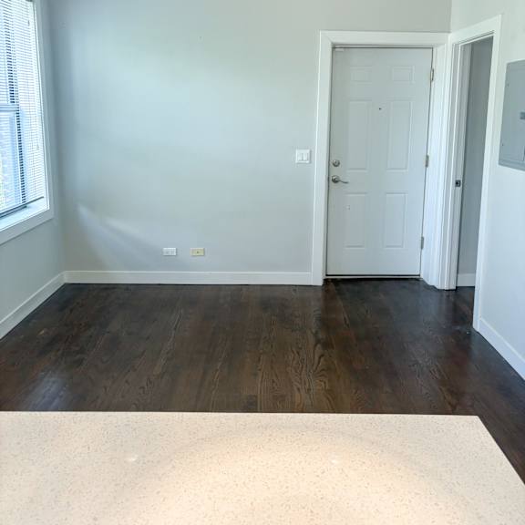 a room with a white door and a window.