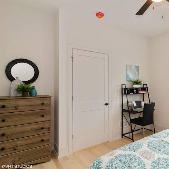 a room with a bed, a dresser, a chair, and a window.