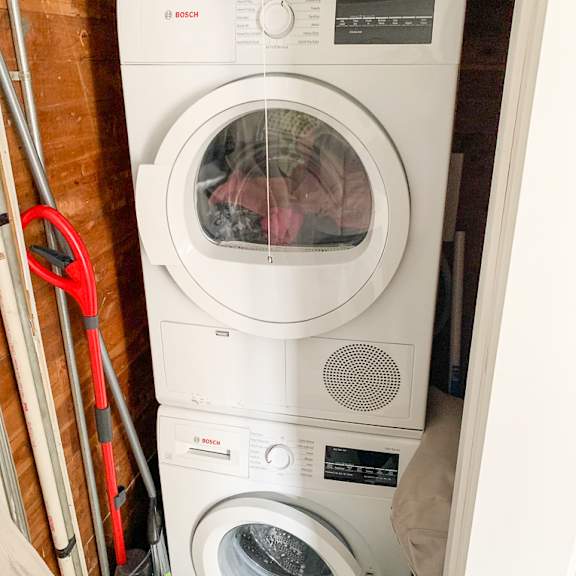 a washing machine and dryer in a small room