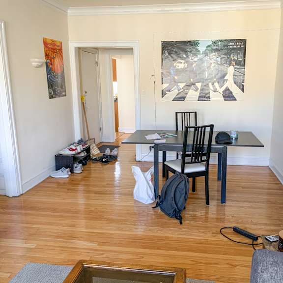 a room with a table and chairs in it.