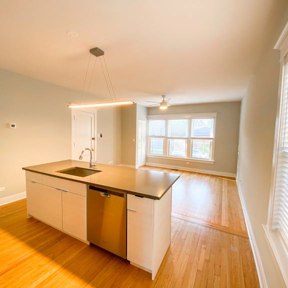 a kitchen with a sink and a window.