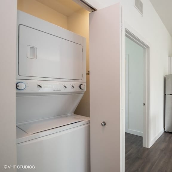 a kitchen with a refrigerator and a stove and