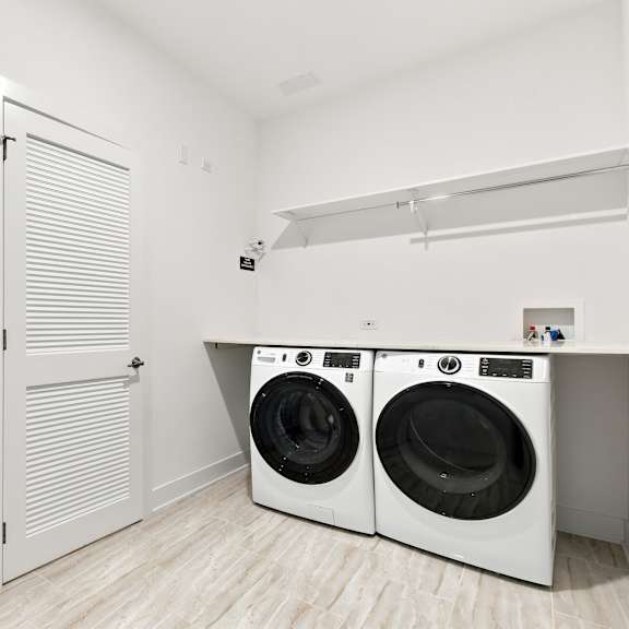 a laundry room with a washer and dryer.