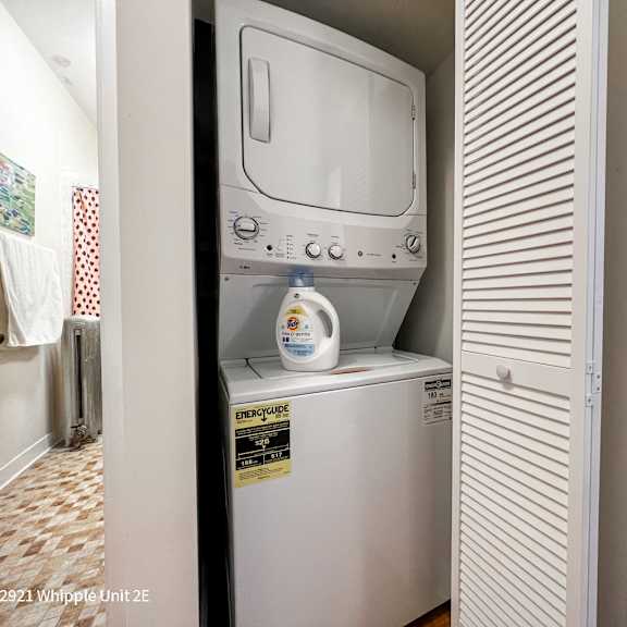 a white whipple unit is in a narrow space between two walls.