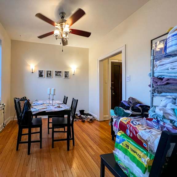 a room with a table and chairs in it.