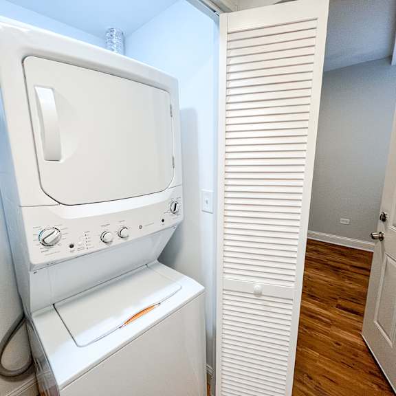 a washer and dryer in a small laundry room
