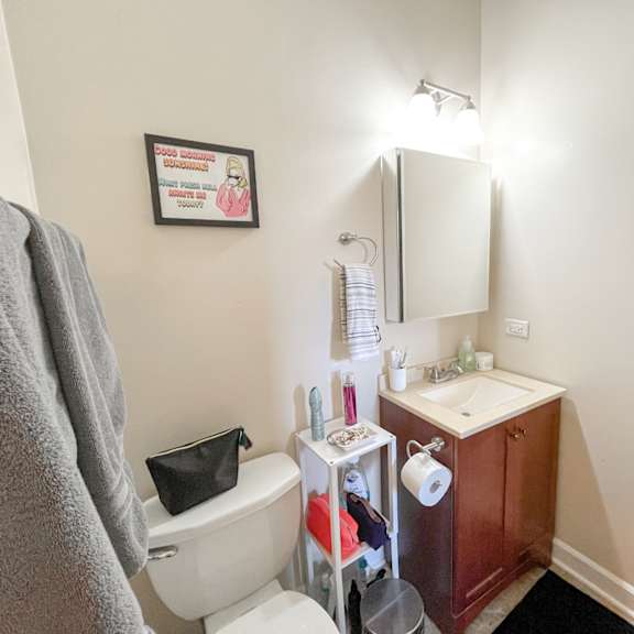 a small bathroom with a toilet sink and mirror
