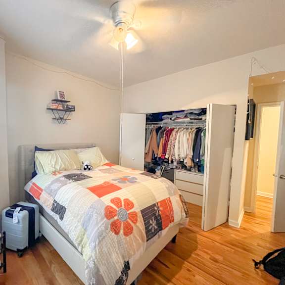 a bedroom with a bed and a closet
