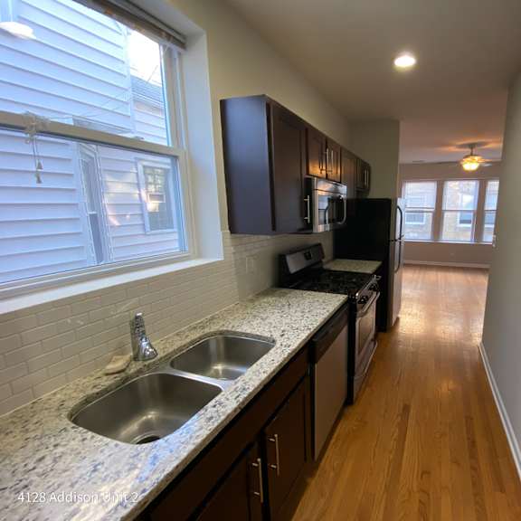 a kitchen with granite counter tops and a sink