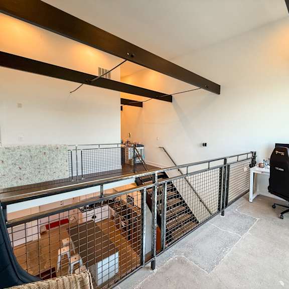 a room with a desk and a computer.