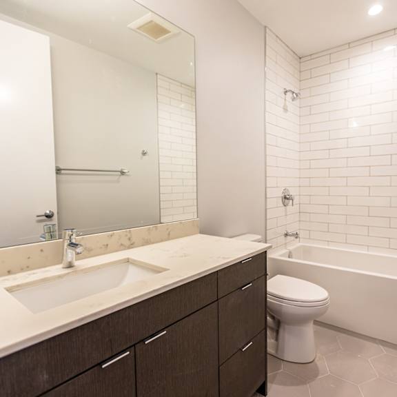 a bathroom with a sink toilet and a bath tub