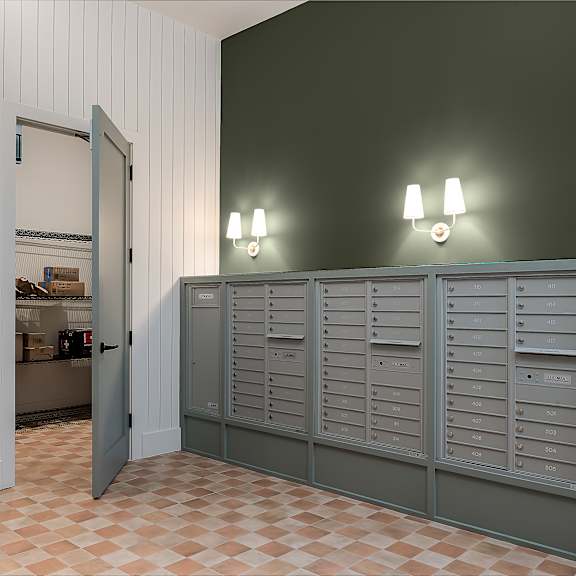 the laundry room has plenty of cabinets and a door to the closet
