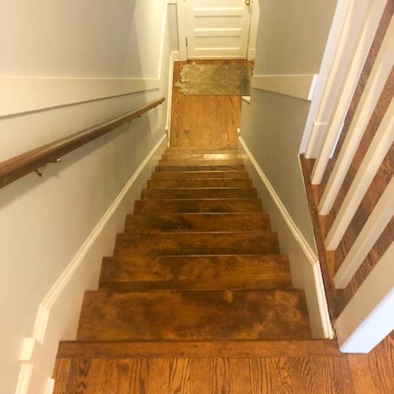 a staircase with wooden steps up and down