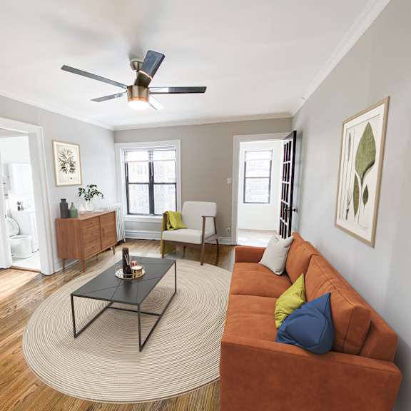 a living room with a brown couch and a black coffee table.
